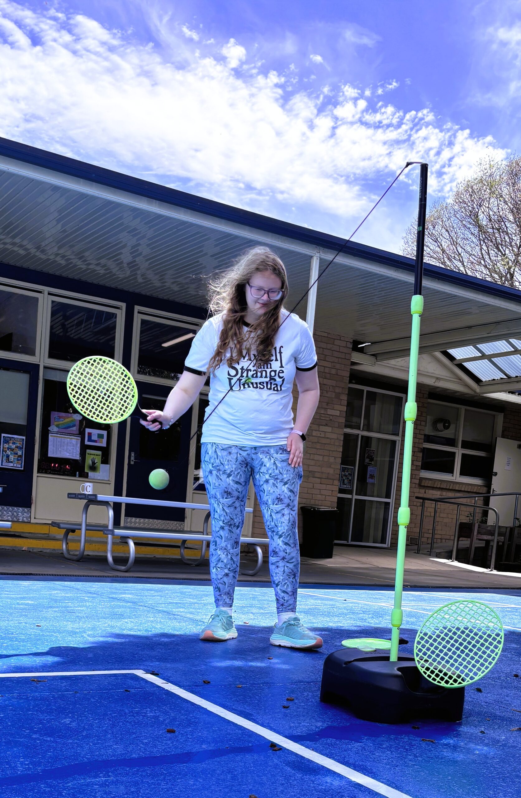 Student playing tennis-style game at Berengarra School