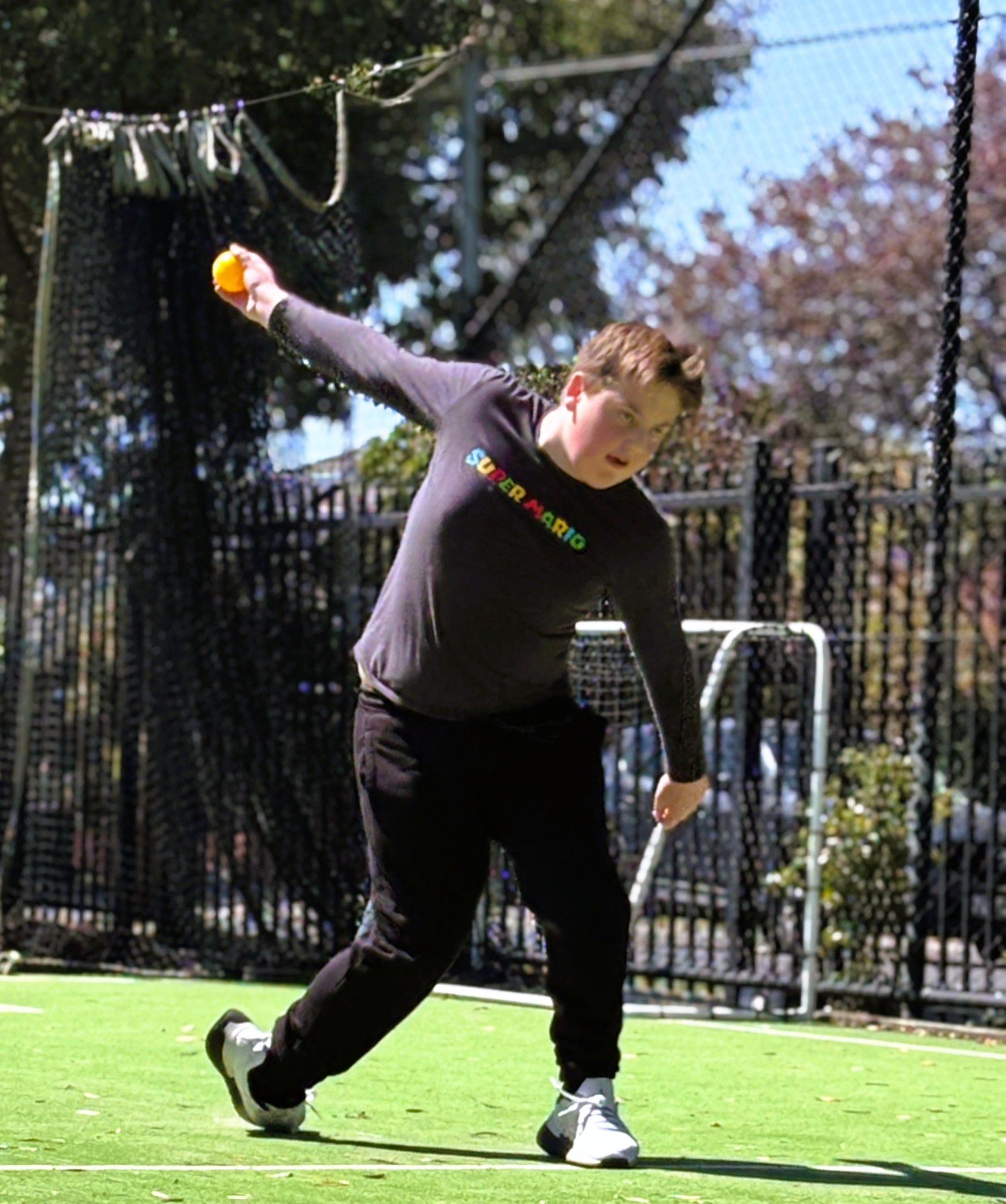 A Berengarra student bowling in a cricket activity